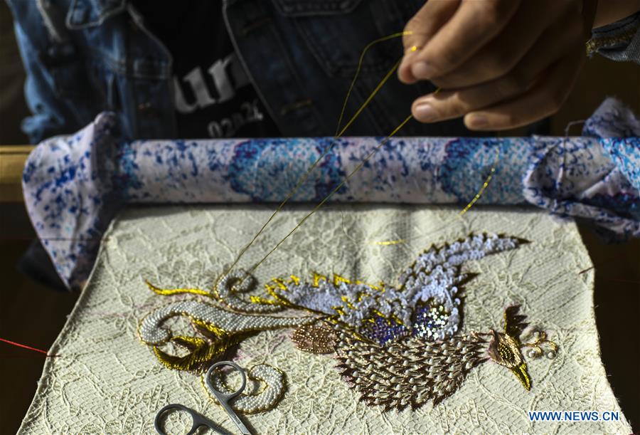 Pic story of embroiderer in NW China's Xinjiang