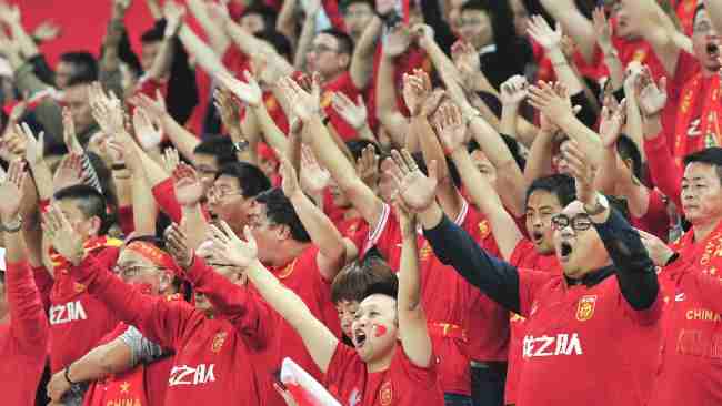 Chinese soccer fans cheering and yelling
